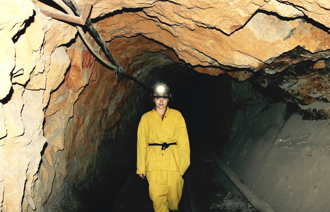 A person walking a working underground face